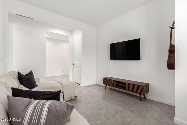 living room featuring visible vents and baseboards