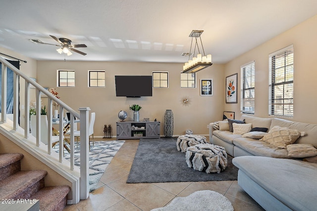 tiled living room with ceiling fan