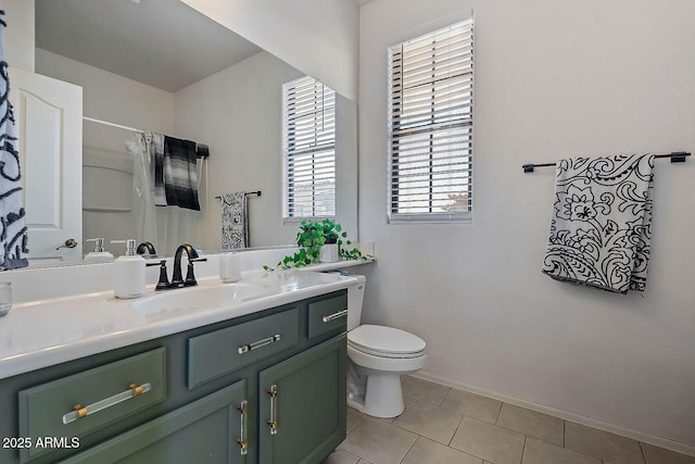 bathroom featuring vanity, a shower with curtain, tile patterned floors, and toilet