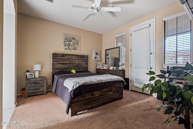 bedroom with ceiling fan, carpet floors, and access to outside