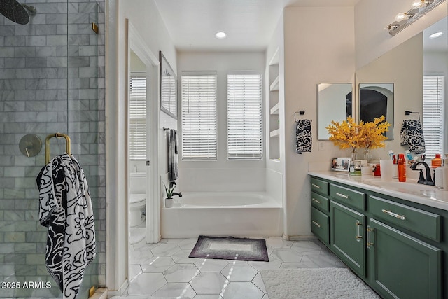 full bathroom featuring vanity, tile patterned floors, plus walk in shower, and toilet