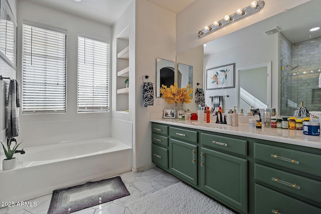 bathroom with vanity and separate shower and tub