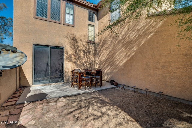 back of property with a patio area