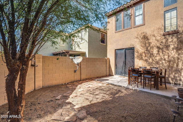 back of property featuring a patio