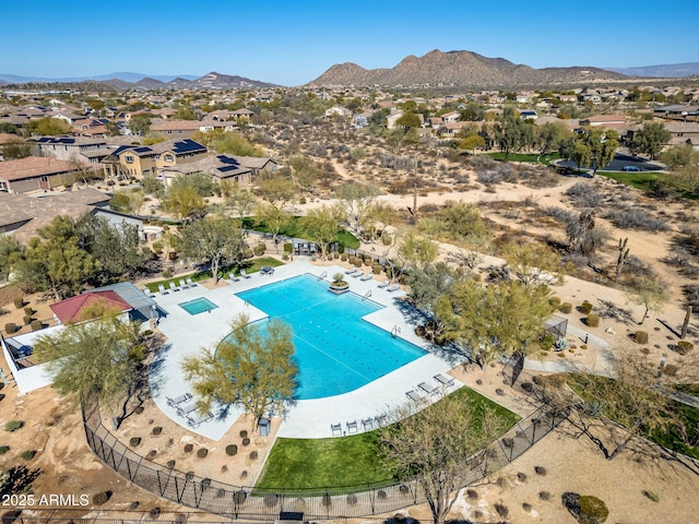 birds eye view of property featuring a mountain view