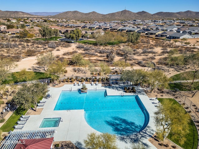 view of swimming pool featuring a mountain view and a patio area