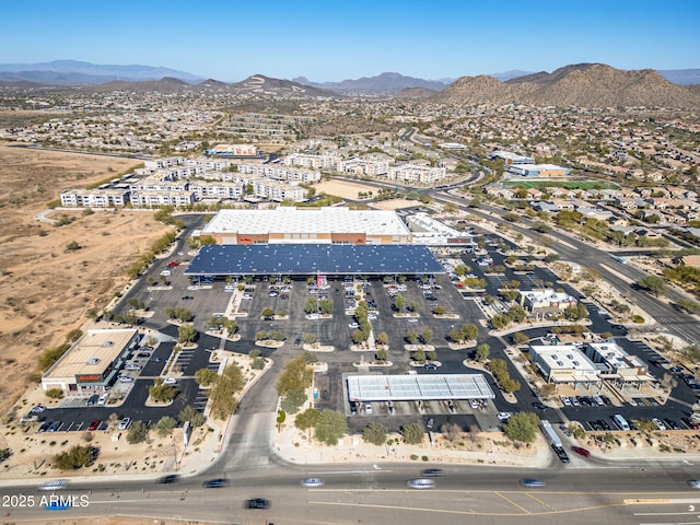 birds eye view of property with a mountain view