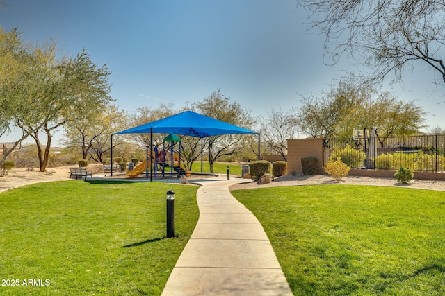 view of community featuring a playground and a yard