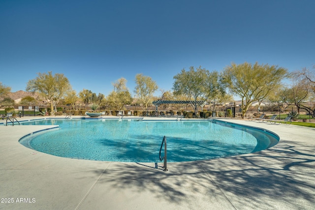 view of pool with a patio and a pergola