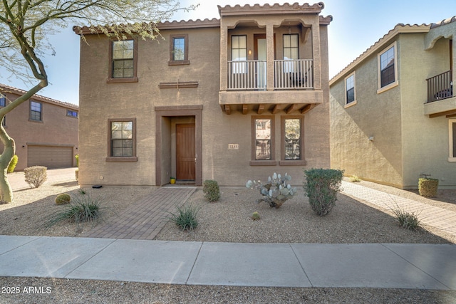 view of front of home featuring a balcony