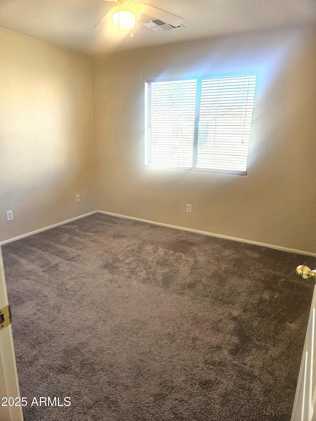 spare room featuring carpet flooring