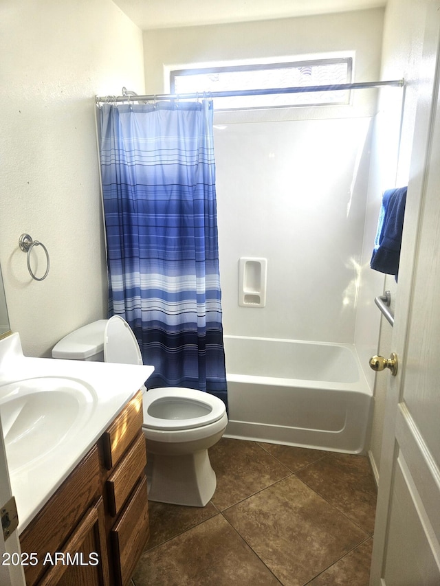 full bathroom with shower / tub combo with curtain, vanity, tile patterned floors, and toilet