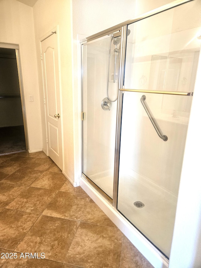 bathroom featuring an enclosed shower