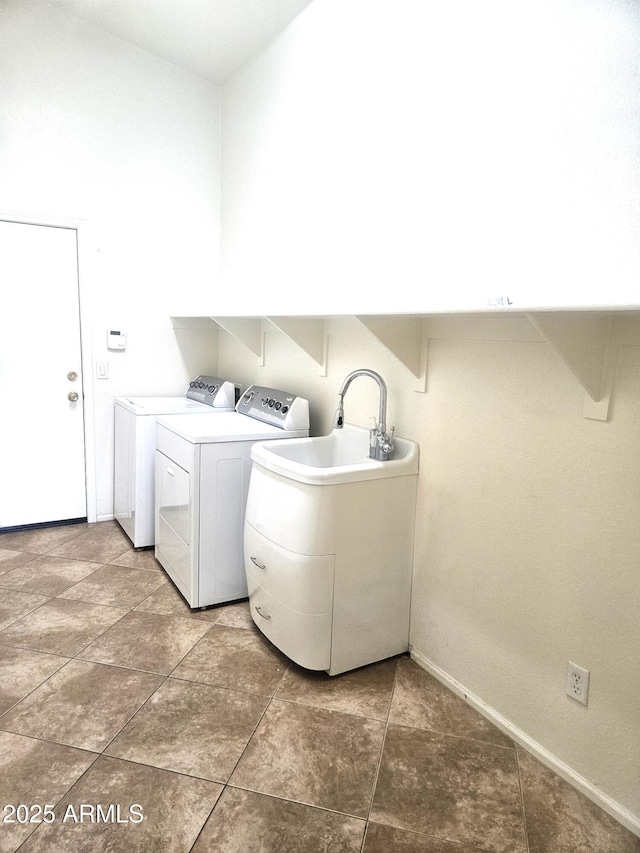 laundry area featuring sink and washing machine and dryer