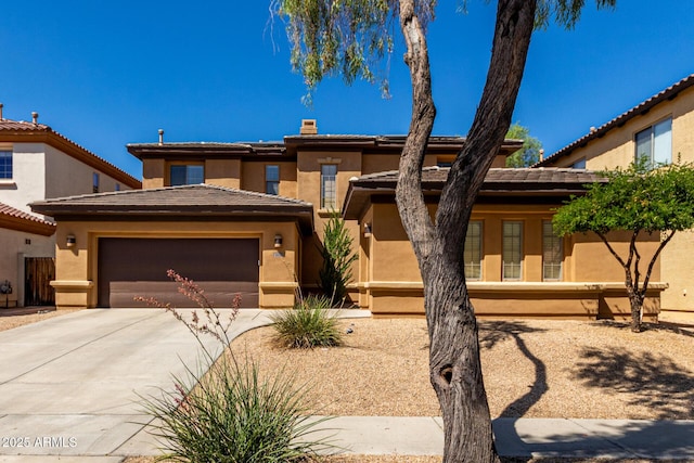 2030 W Whisper Rock Trl, Phoenix, AZ 85085 - view of front facade with driveway, stucco siding, and a garage