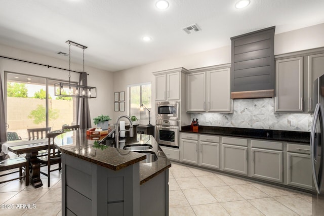2030 W Whisper Rock Trl, Phoenix, AZ 85085 - kitchen featuring stainless steel appliances, gray cabinetry, healthy amount of natural light, recessed lighting, and light tile patterned floors