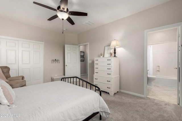 2030 W Whisper Rock Trl, Phoenix, AZ 85085 - bedroom featuring a closet, light colored carpet, ensuite bathroom, and a ceiling fan