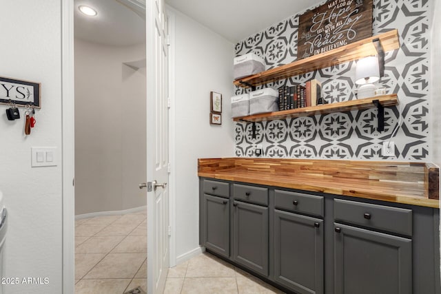 2030 W Whisper Rock Trl, Phoenix, AZ 85085 - bar with light tile patterned flooring and baseboards
