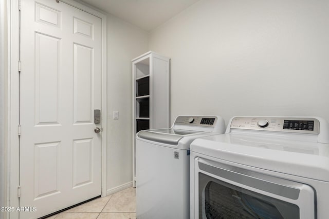2030 W Whisper Rock Trl, Phoenix, AZ 85085 - laundry area featuring washing machine and dryer and light tile patterned floors