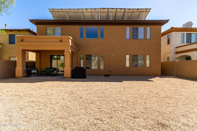 2030 W Whisper Rock Trl, Phoenix, AZ 85085 - rear view of house with a patio area, stucco siding, and outdoor lounge area