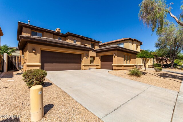 2030 W Whisper Rock Trl, Phoenix, AZ 85085 - view of front facade featuring stucco siding, concrete driveway, an attached garage, a gate, and a tiled roof