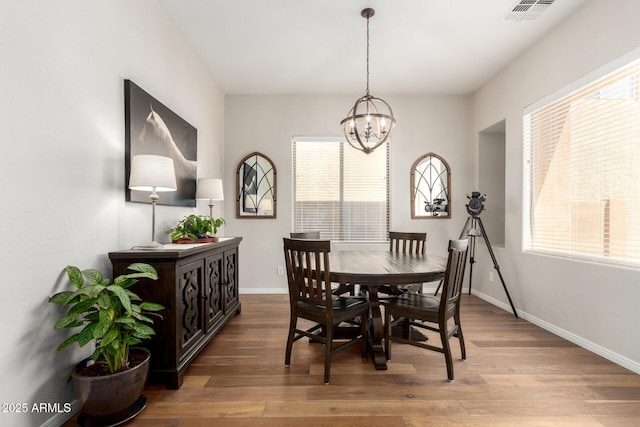 2030 W Whisper Rock Trl, Phoenix, AZ 85085 - dining room with wood finished floors and a chandelier