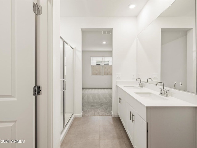 full bath featuring a sink, visible vents, a shower stall, and tile patterned floors