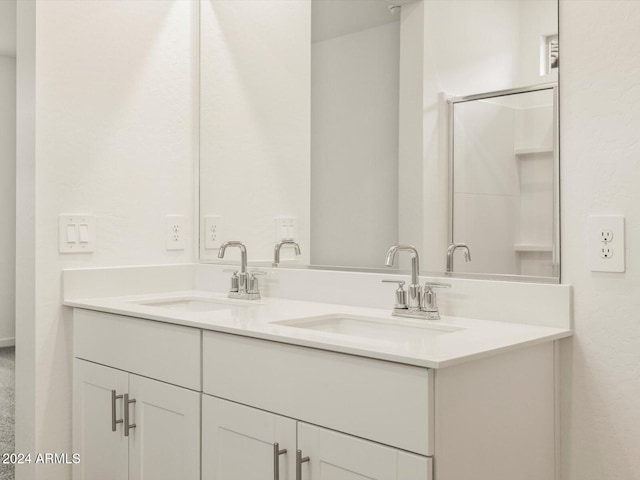 bathroom with double vanity and a sink