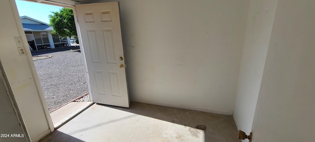 doorway with concrete flooring