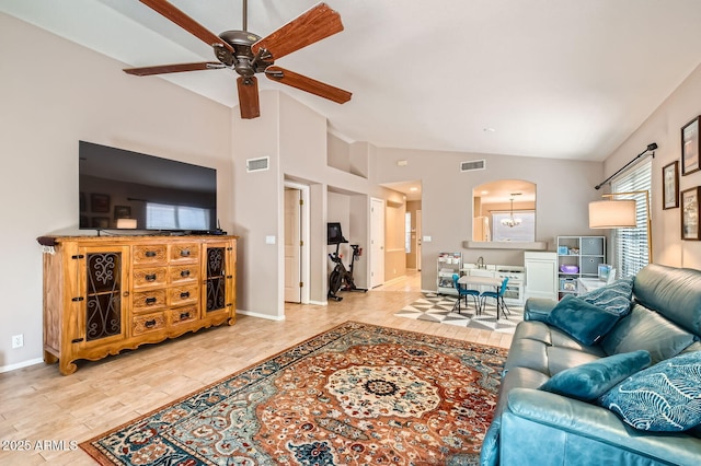 living room with arched walkways, ceiling fan, vaulted ceiling, and visible vents