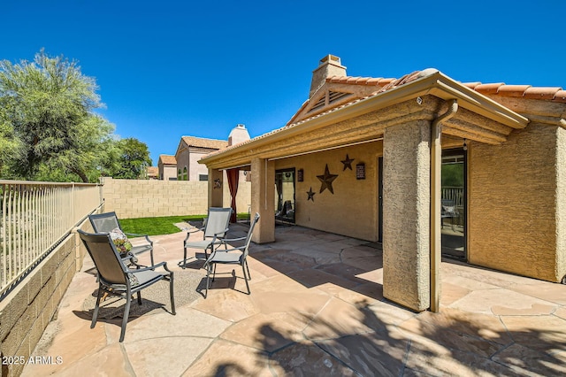 view of patio / terrace with fence
