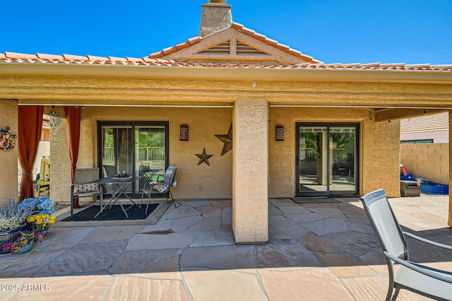 back of house featuring a patio and stucco siding