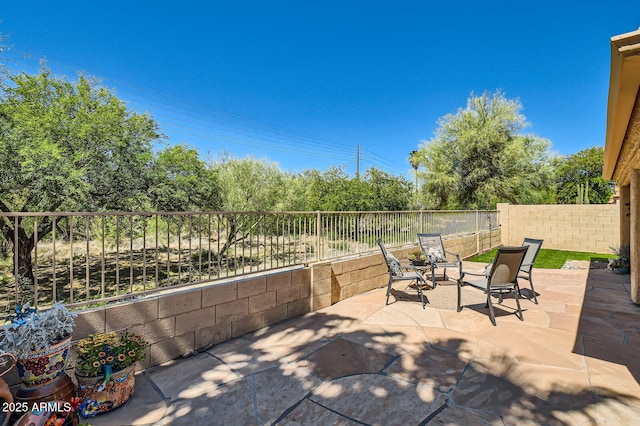 view of patio with a fenced backyard