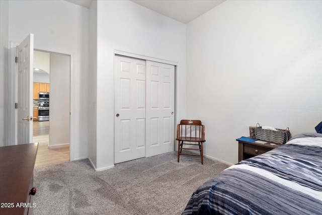 carpeted bedroom with a closet