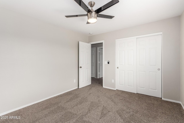 unfurnished bedroom featuring a closet, baseboards, carpet floors, and ceiling fan