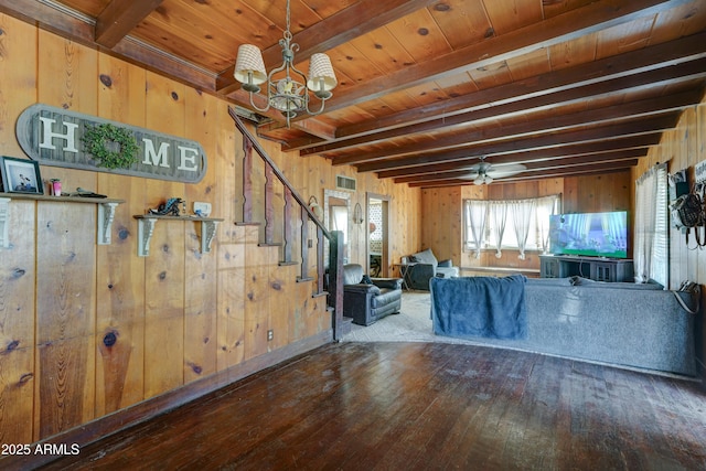 living room featuring beam ceiling, wooden ceiling, hardwood / wood-style flooring, and wood walls