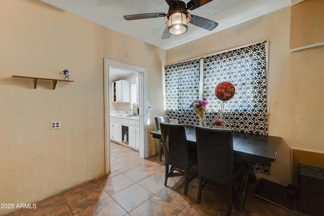 dining room featuring sink and ceiling fan