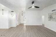 spare room featuring hardwood / wood-style floors and ceiling fan