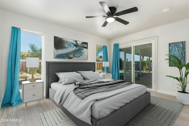 bedroom with access to exterior, ceiling fan, and light wood-type flooring