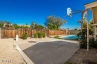 exterior space with a fenced in pool