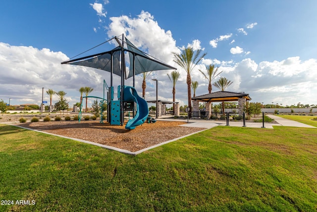communal playground featuring a gazebo and a yard