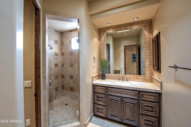 bathroom with vanity and an enclosed shower