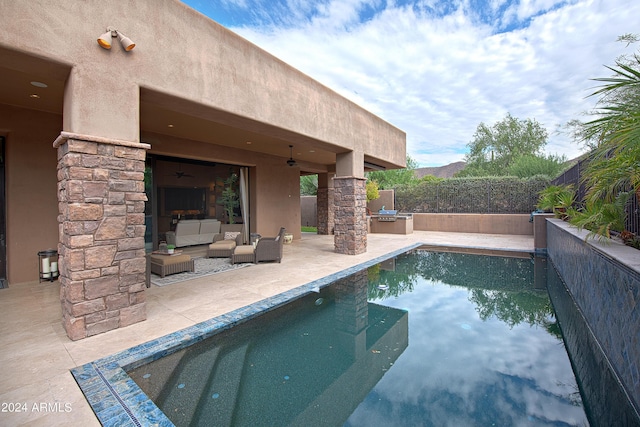 view of pool featuring area for grilling, a patio area, outdoor lounge area, and ceiling fan