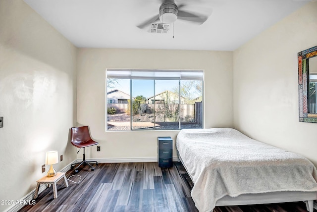 bedroom featuring ceiling fan and dark hardwood / wood-style flooring