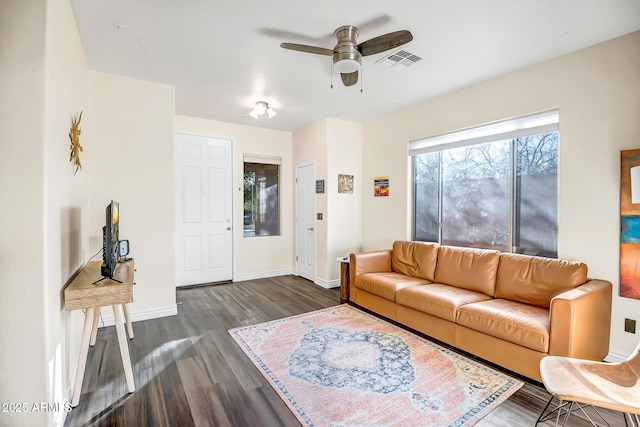 living room with ceiling fan and dark hardwood / wood-style floors