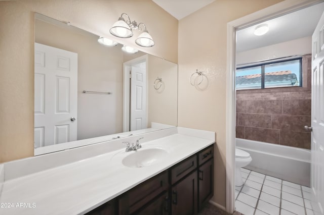 bathroom with tile patterned flooring, vanity, toilet, and a notable chandelier