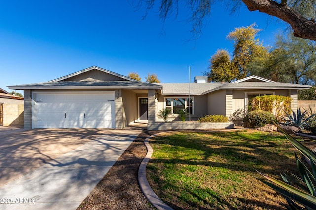 ranch-style house featuring a garage and a front lawn