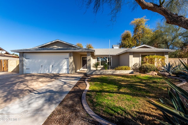 ranch-style home with a garage and a front yard