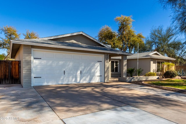 ranch-style home featuring a garage