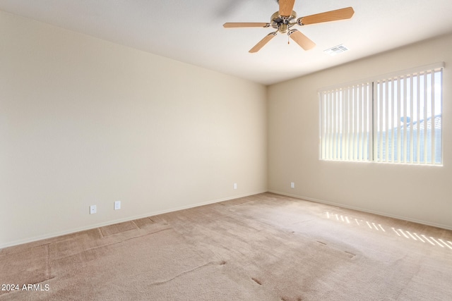 carpeted empty room with ceiling fan